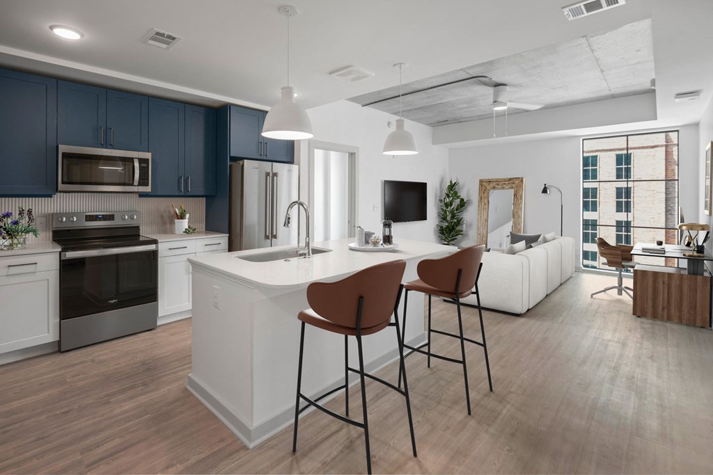 a kitchen and living room in a 555 waverly unit