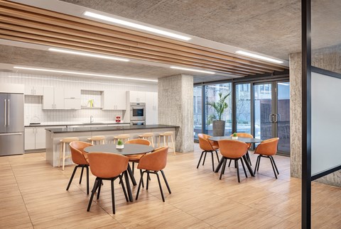 a dining room and kitchen with a table and chairs