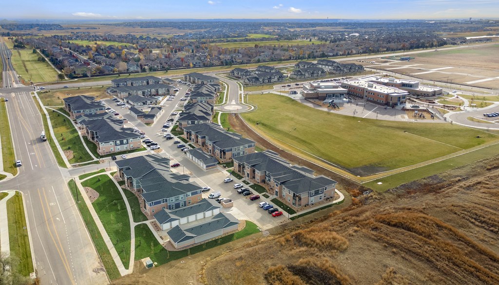 an aerial view of a group of buildings and an airport