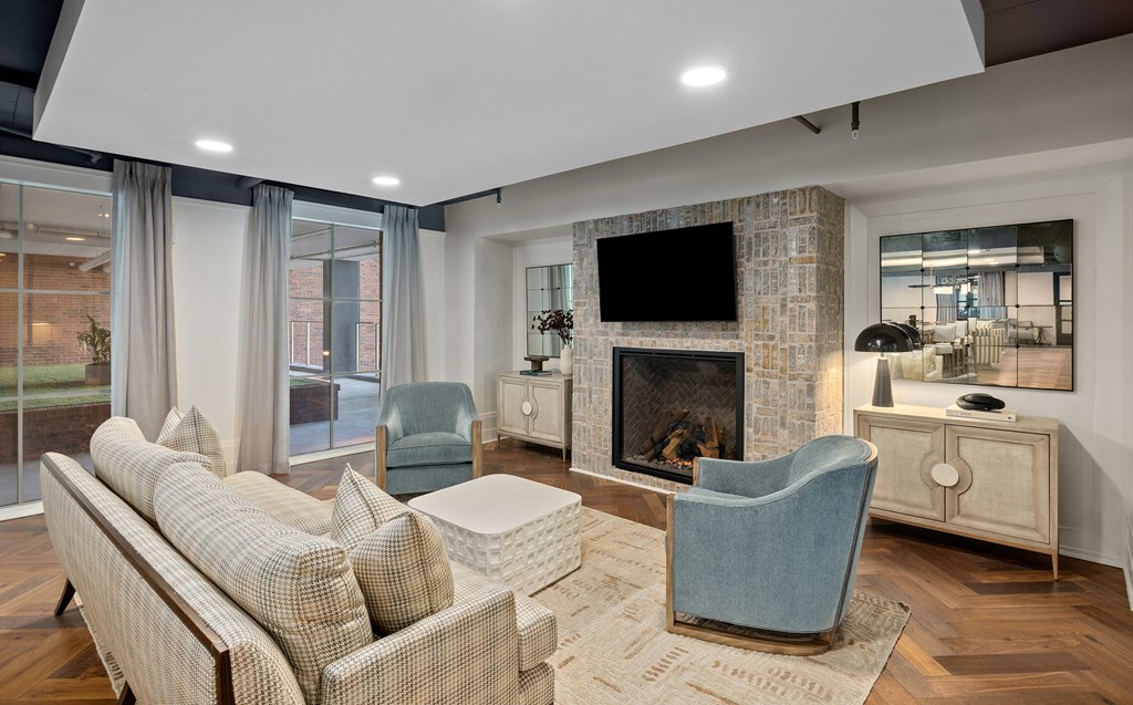 A living room with a fireplace and a television.