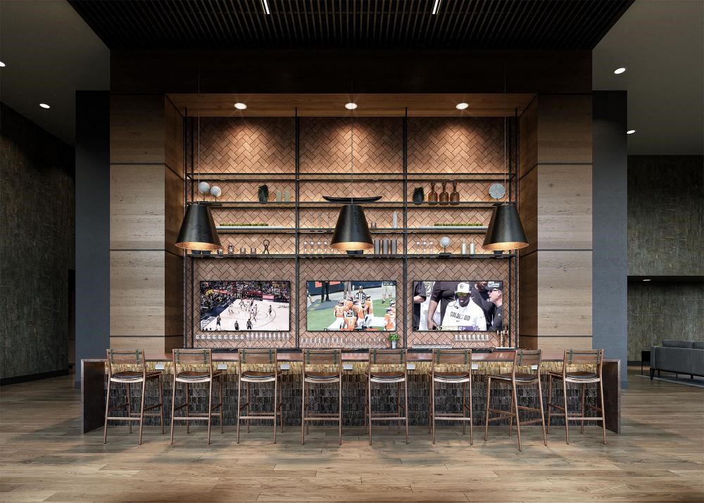 the bar in the lobby of a restaurant with chairs