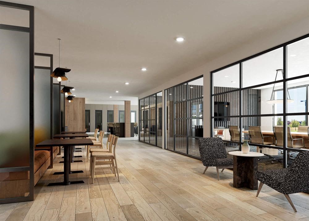 a large living room with a table and chairs