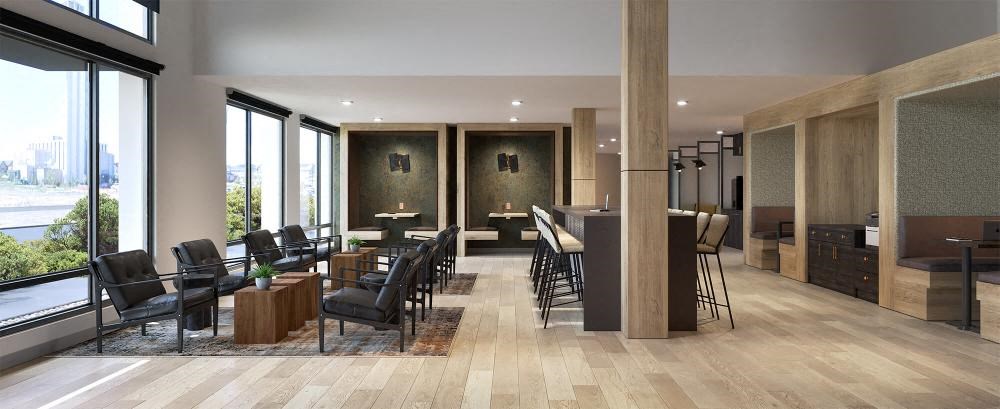 a lobby with a bar and chairs and tables