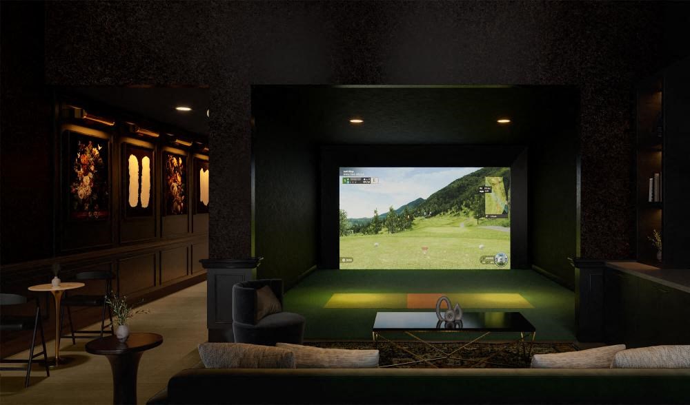 a living room with a large screen tv and a couch