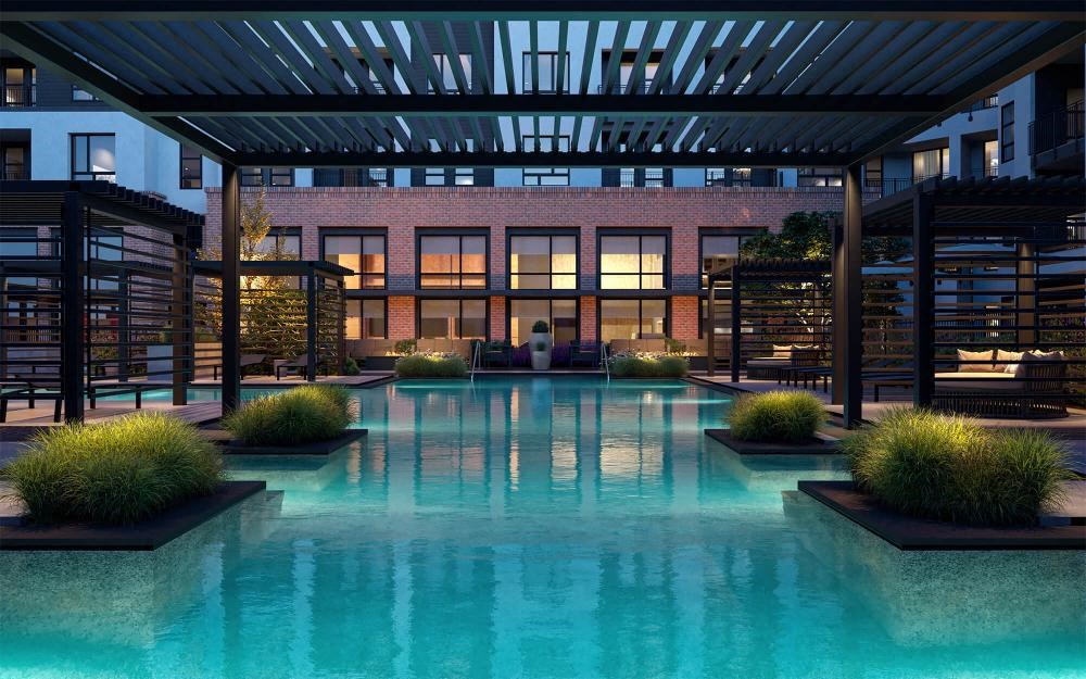 a swimming pool with a building in the background