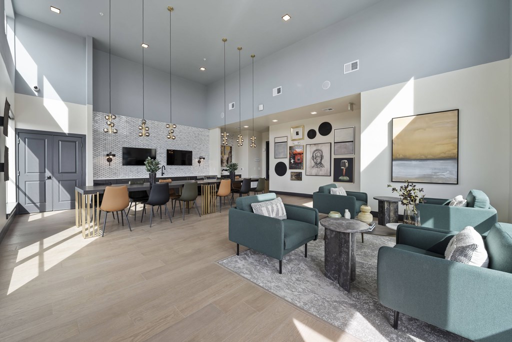 A modern living room with a grey sofa set and a wooden coffee table.