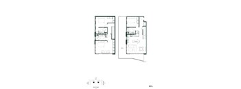 A floor plan of a two-story residential building with labeled rooms.