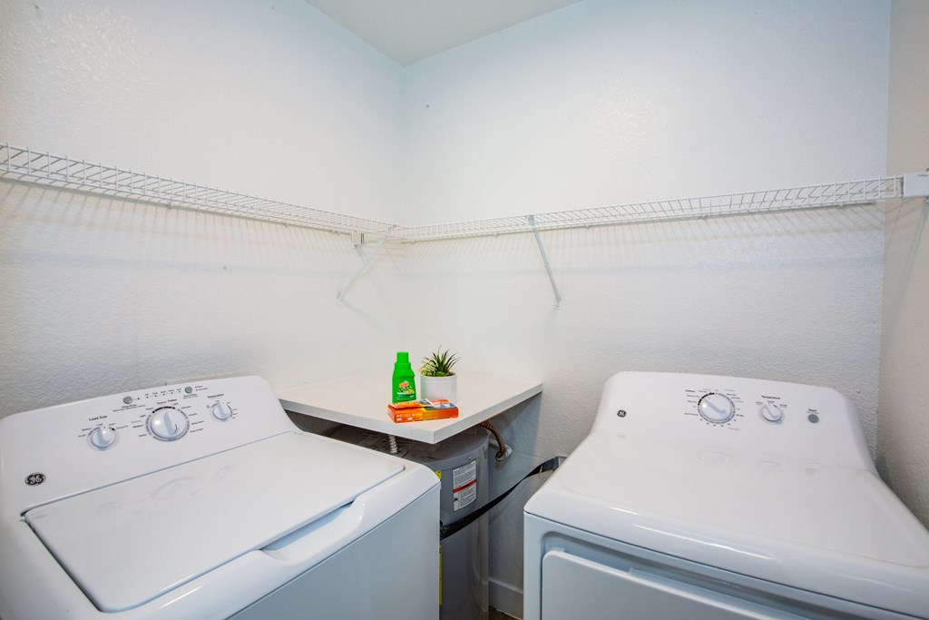 A laundry room with a washer and dryer.