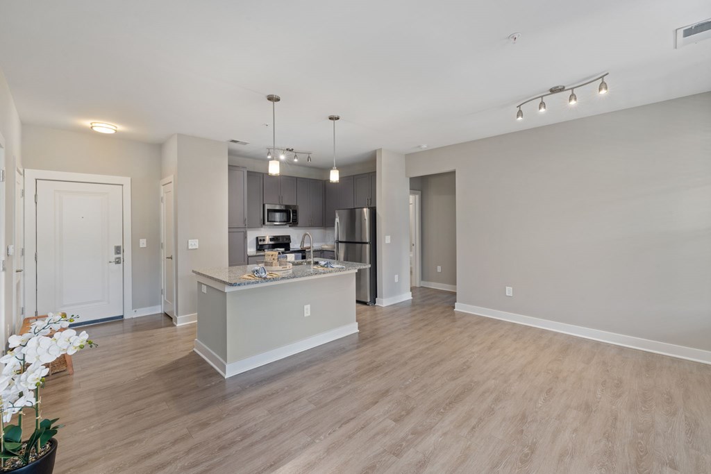 A kitchen with a countertop and a microwave on it.