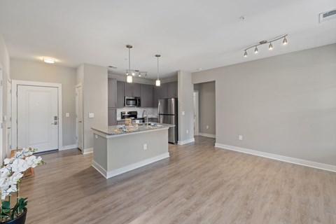 A kitchen with a countertop and a microwave on it.