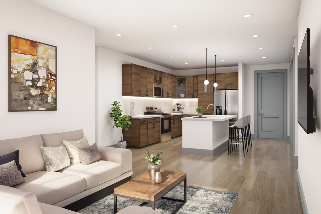 A modern living room with a white sofa and a coffee table.