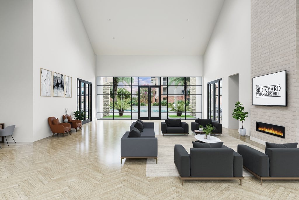 A living room with a fireplace and a large window.