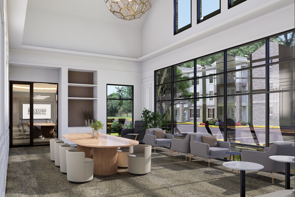 A modern waiting room with a reception desk and chairs.