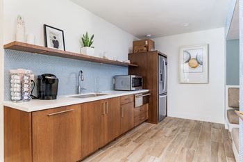Kitchen with Refrigerator and wooden cabinets  at Softwind Point, Vista, CA, 92081