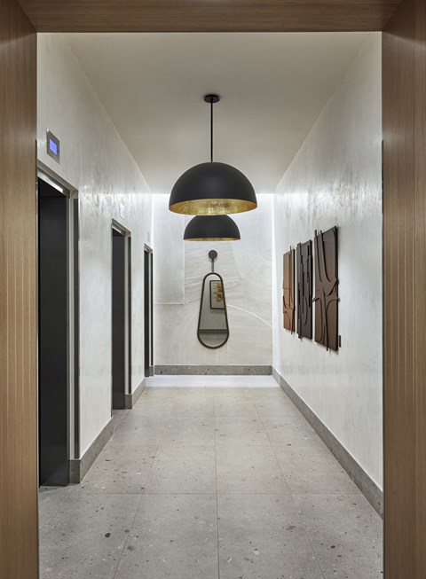 Indoor elevator space with ceiling lighting