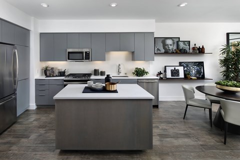 A modern kitchen with a large island in the center.