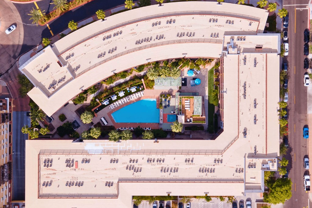 A large building with a pool in the middle of it.