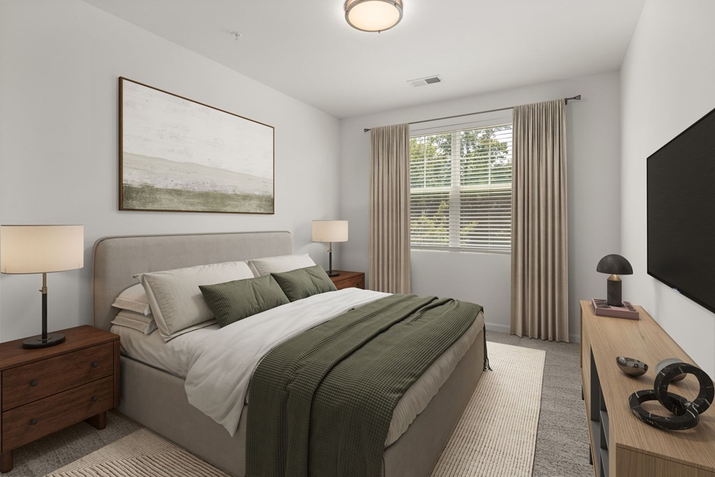 A bedroom with a large bed and a painting on the wall.