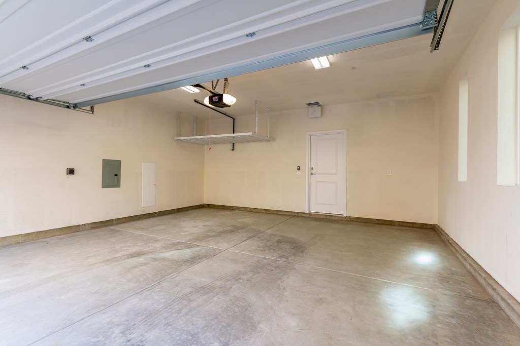 Garage with concrete floor and white walls.