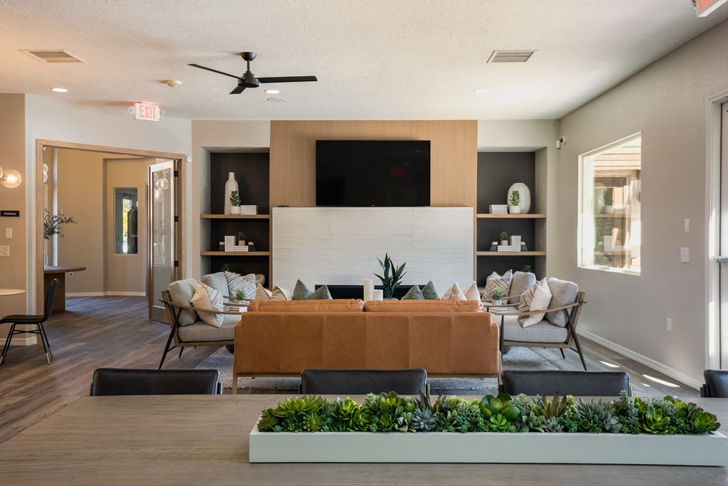 a large living room with a couch and a tv