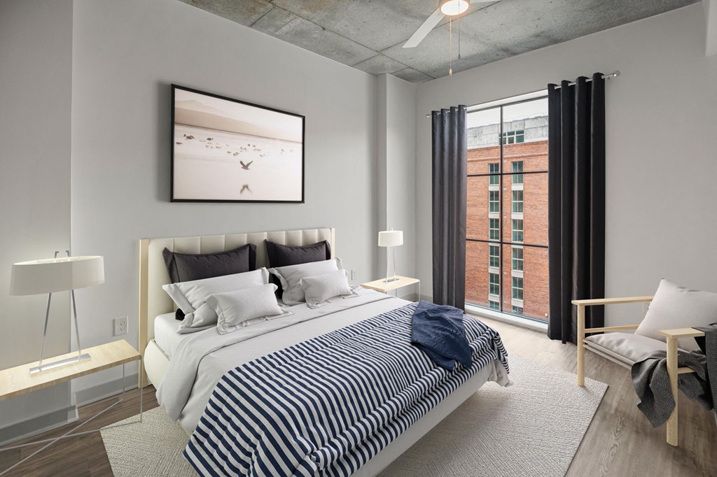 a bedroom with a bed and a window