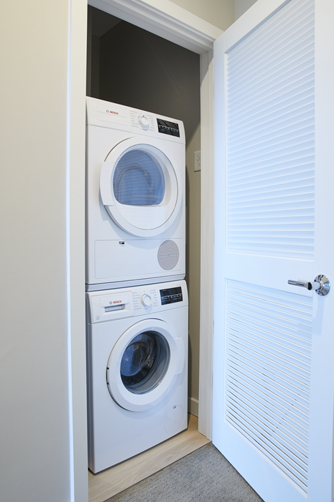 a small laundry room with a washer and dryer