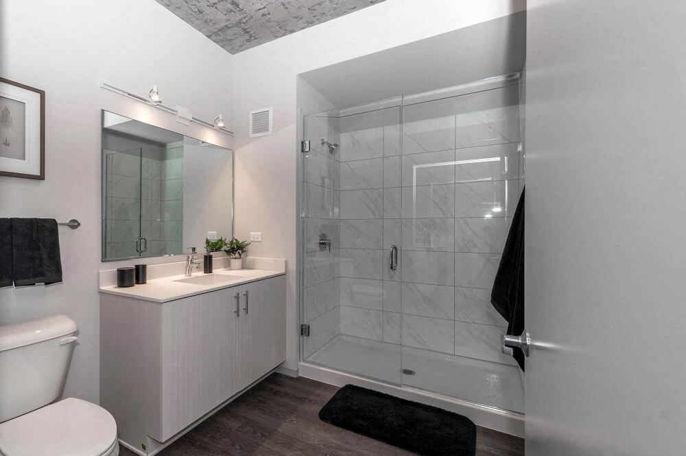 a bathroom with a shower and a sink