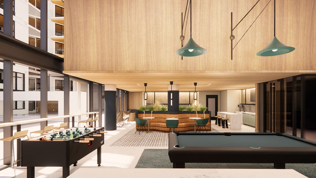 a lounge area with a pool table and a bar