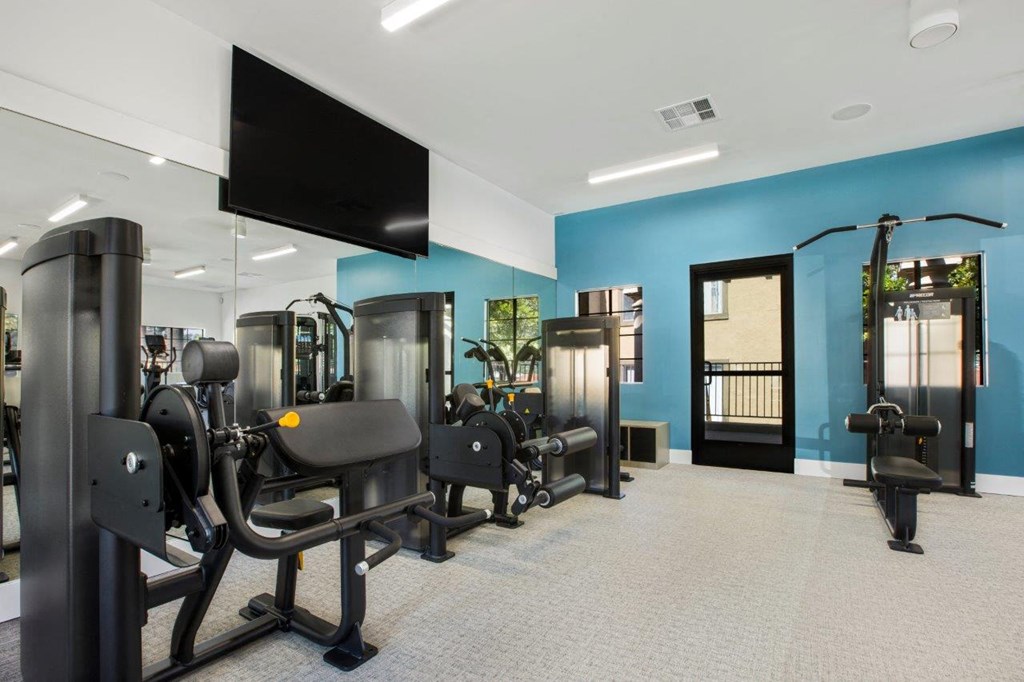 Gym with exercise equipment and a tv  at Bella Terra, Vista, CA, 92081
