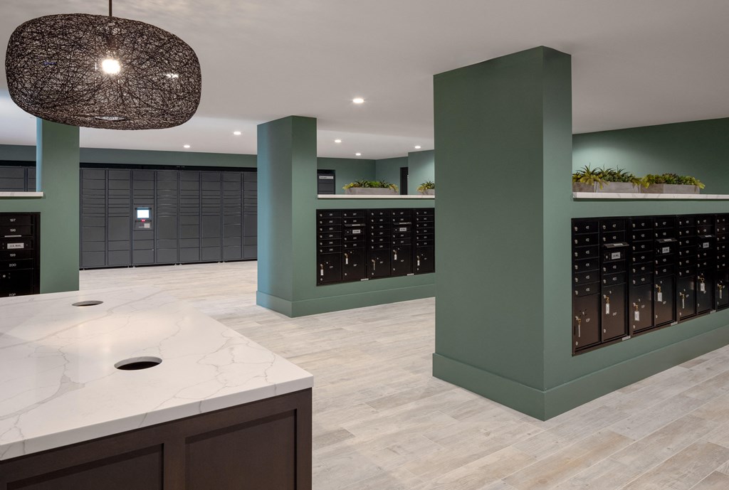 a large wine cellar with a marble counter top and a green wall with a rack