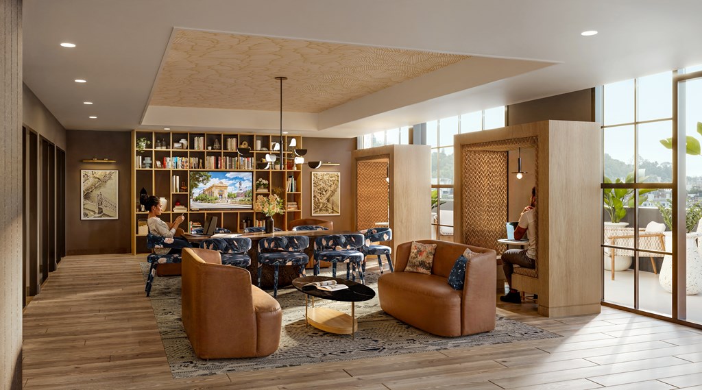 A modern living room with a person sitting on a couch.