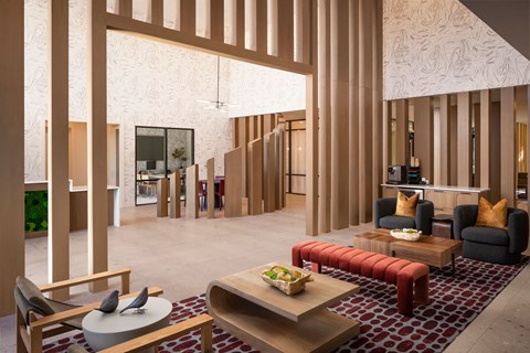 A modern living room with a wooden floor and furniture.