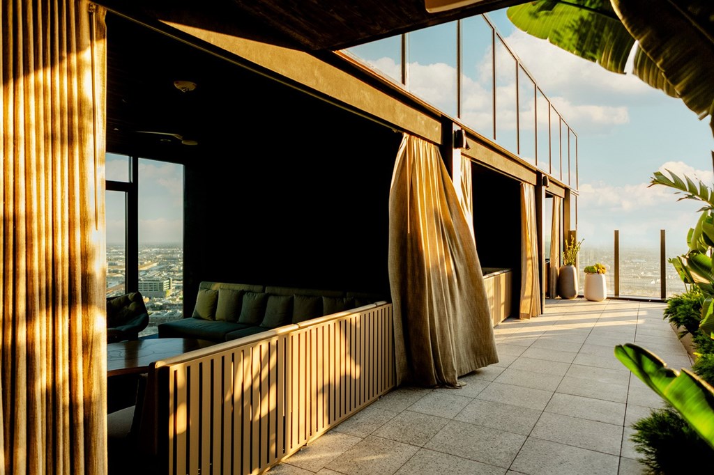 A modern balcony with a view of the city.