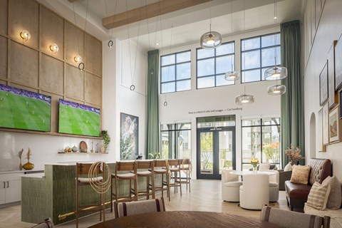 A modern living room with a television and a bar area.
