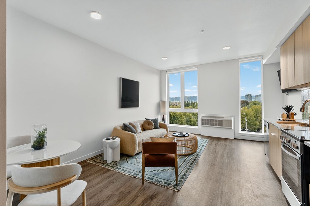 A modern living room with a white sofa and a wooden coffee table.