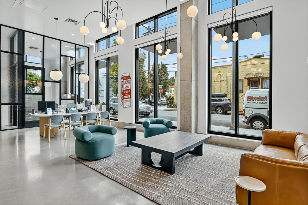 A modern waiting room with a view of the street outside.