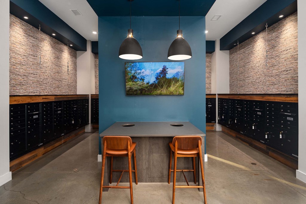 a tasting room with blue walls and a table with chairs