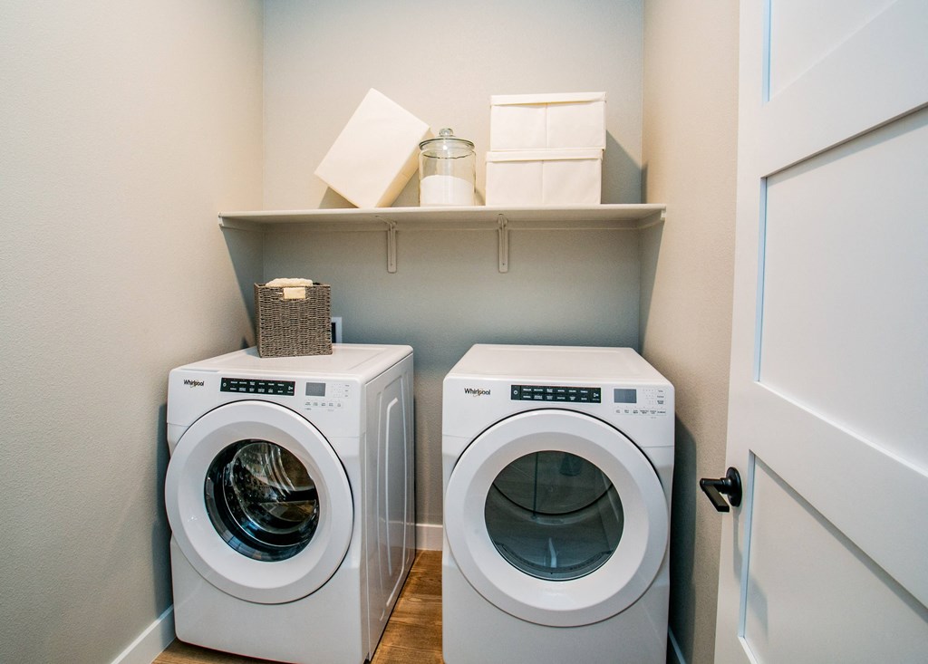 a small laundry room with a washer and dryer