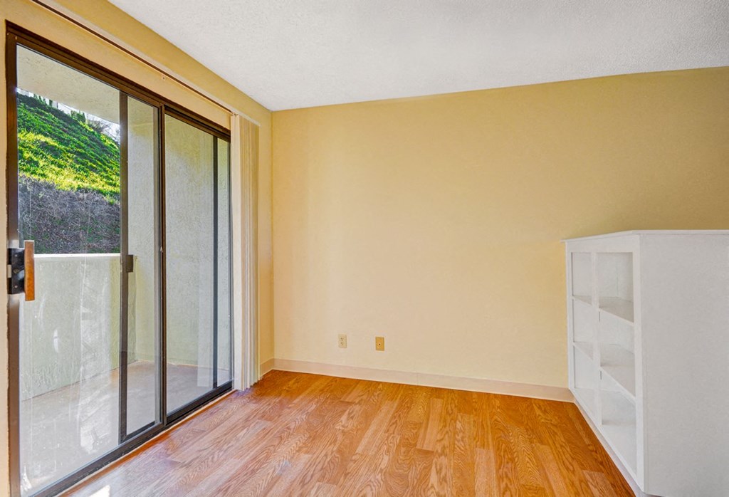 Vacant Apartment window and wooden floor  at Navajo Bluffs, San Diego, 92119
