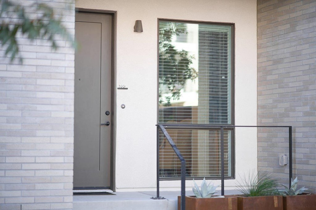 Street level entry to townhome with patio