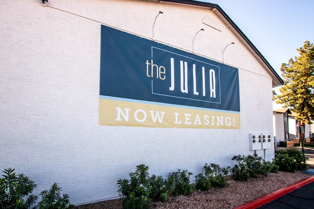 a sign on the side of a building that says the julia now leasingat The Julia, Mesa