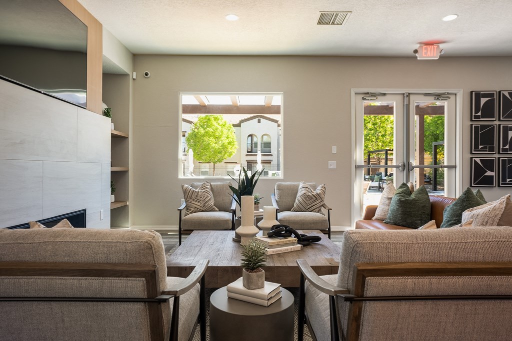 a living room with couches and chairs and a fireplace