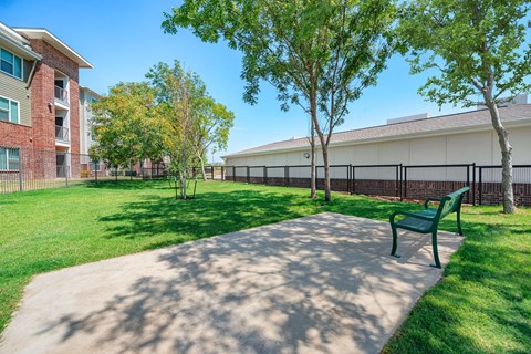 enclosed dog park with benches