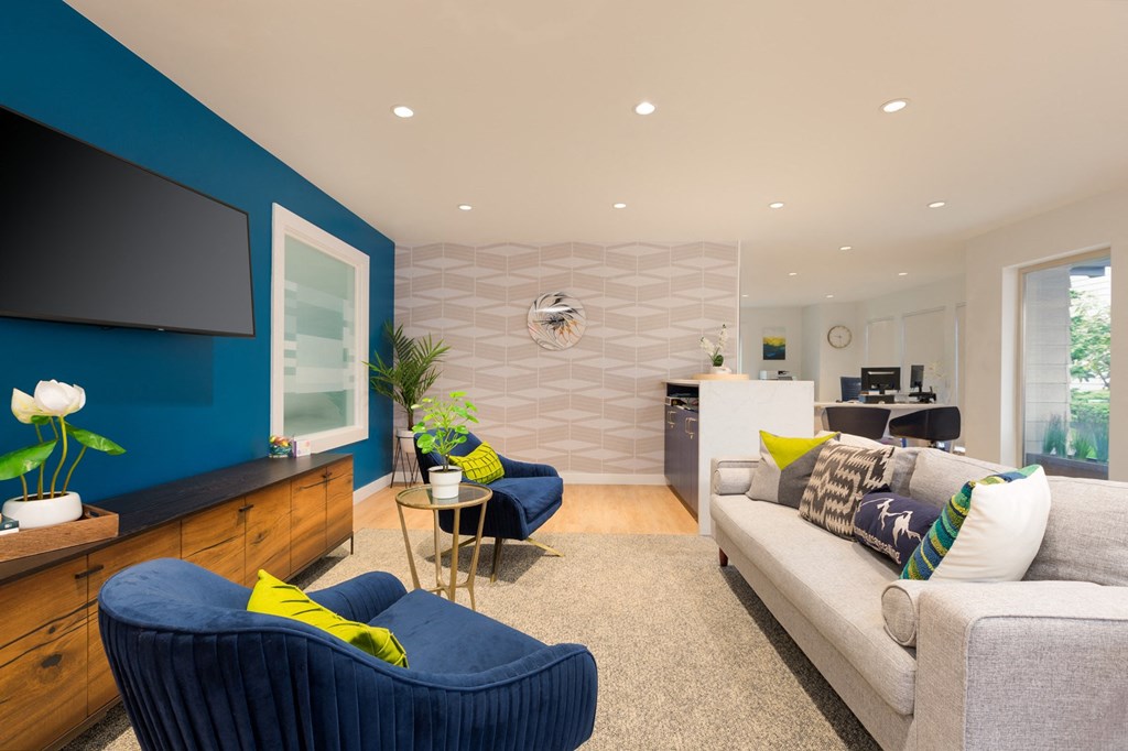 a living room filled with furniture and a flat screen tv