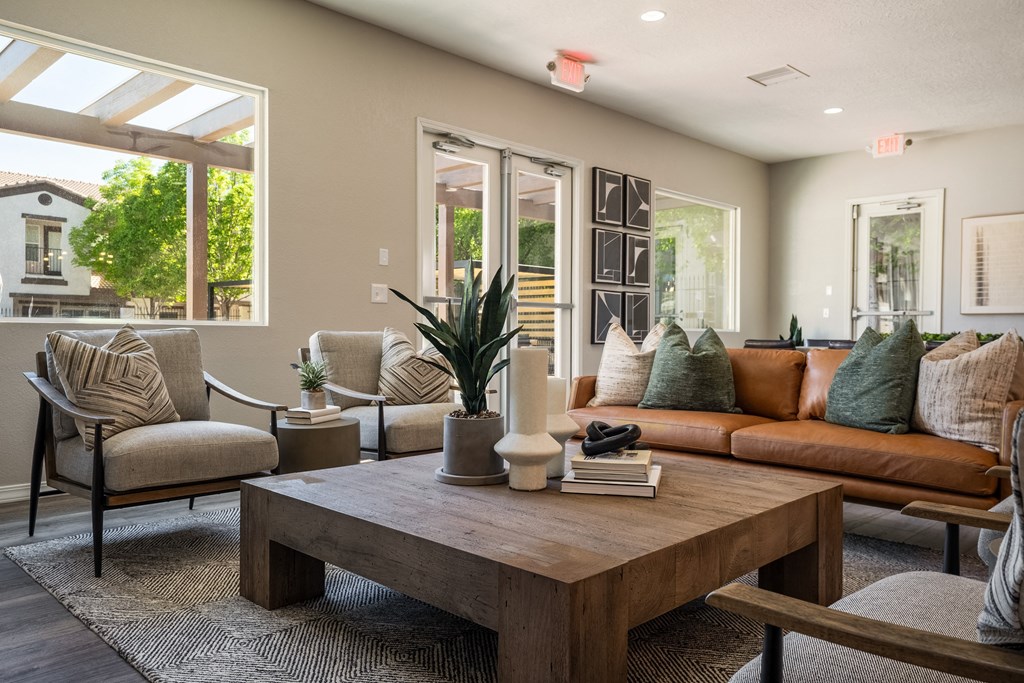 a living room with couches and chairs and a coffee table