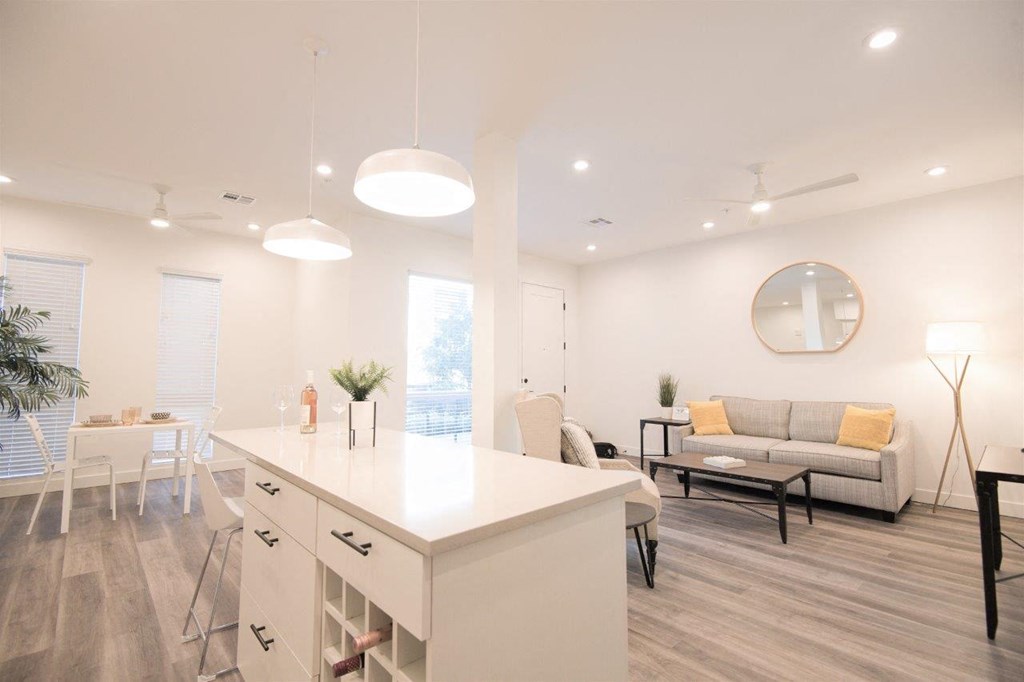 an open floor plan with a kitchen and living room