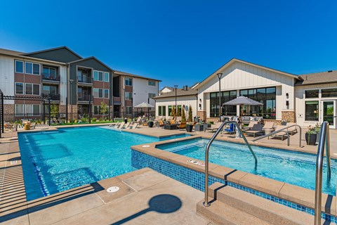Swimming pool with hot tub at Firestone Junction apartments for rent in Northern Colorado.