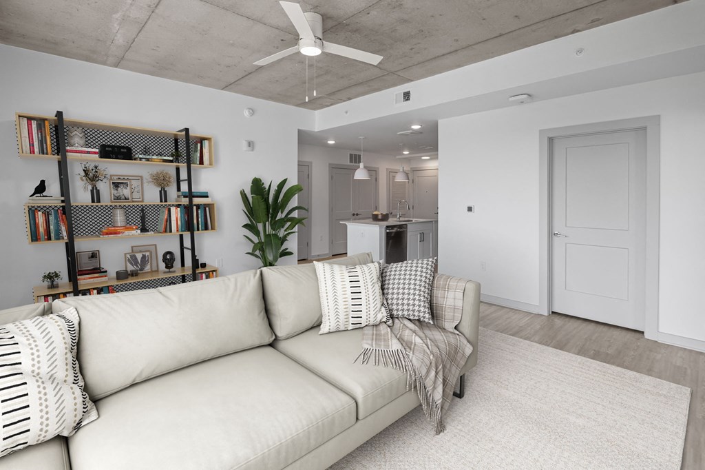 a living room with a couch and a bookshelf