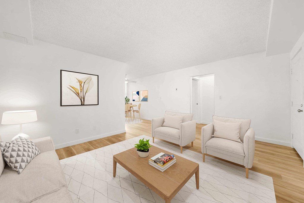 a living room with two chairs and a coffee table