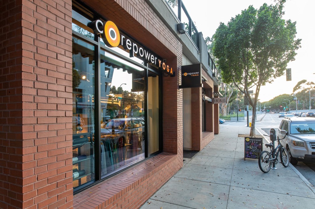 a bike parked on a sidewalk in front of a building